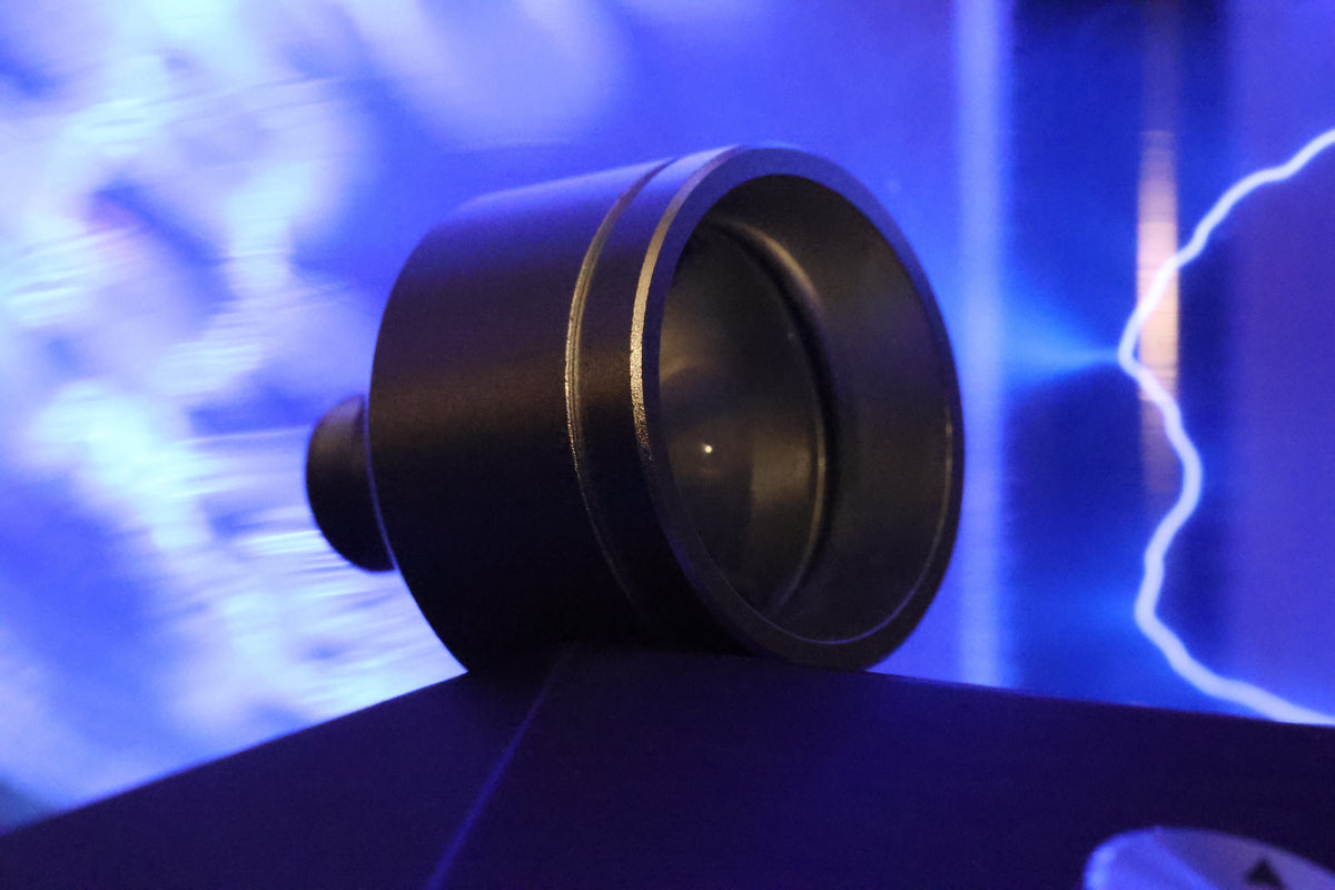 Custom machined laser optic under blue light